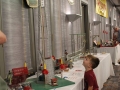 Child gawks at an Erector Parachute Jump model