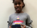 Arnae shows off her Erector model