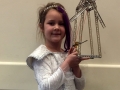 Ella shows off her Erector model