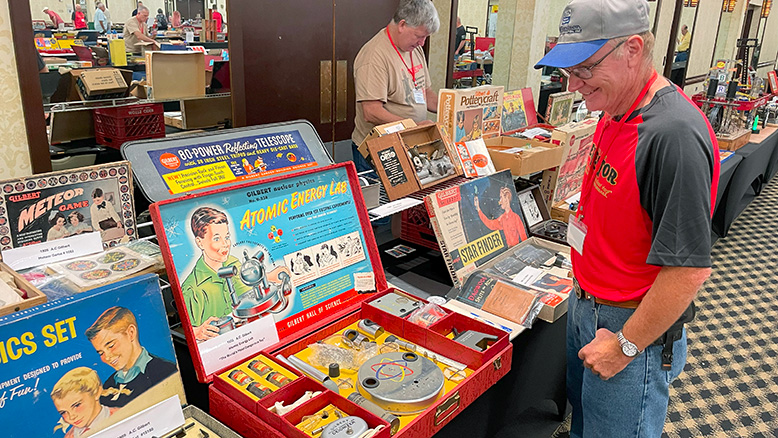 Nathan Good admires Greg Bilek's Gilbert Atomic Energy Lab.